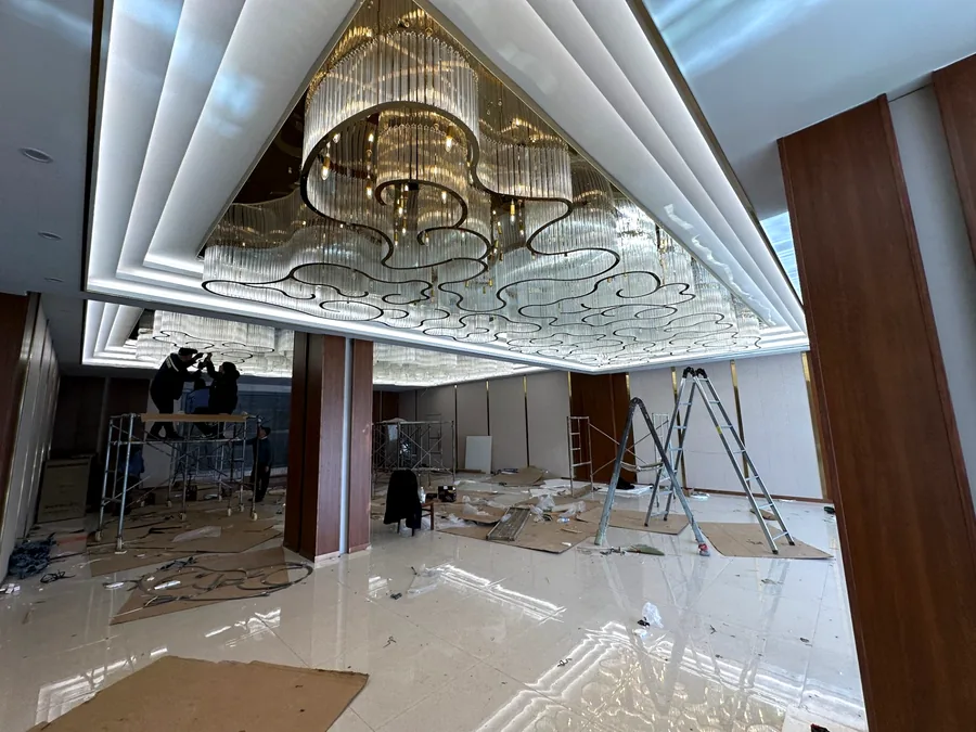 Hotel ballroom — cloud-outline crystal ceiling during installation