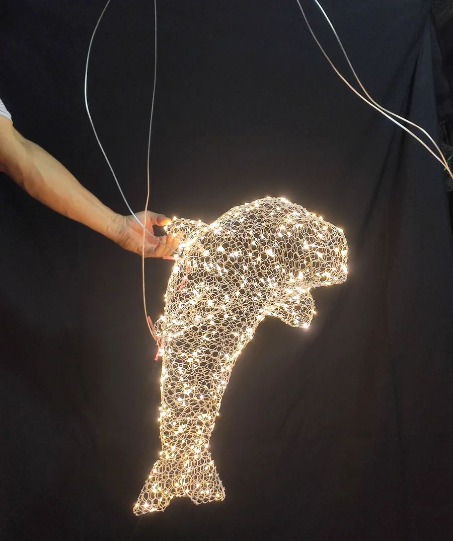 Hand-woven dolphin light sculpture — bespoke art installations